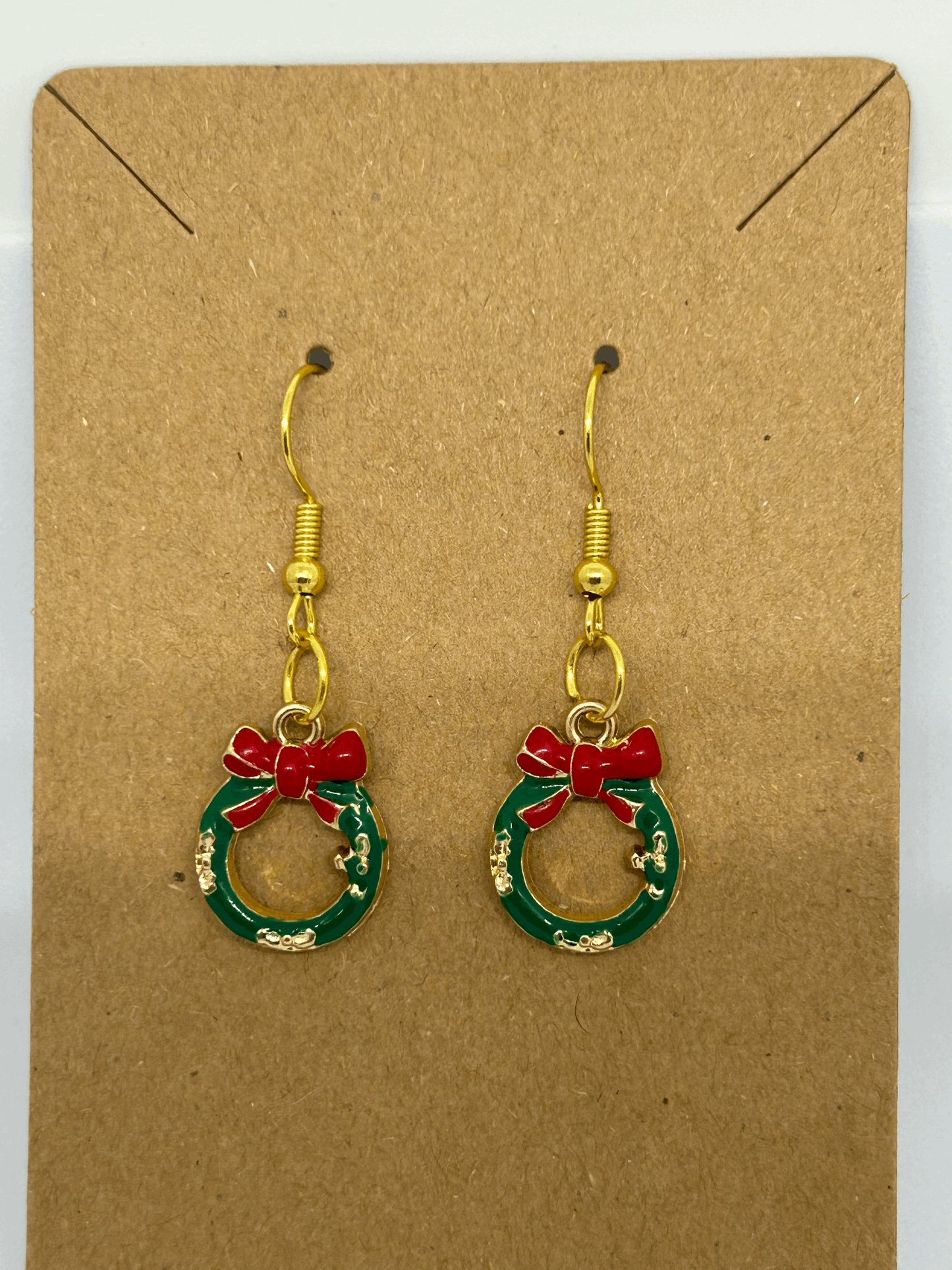 Green miniture wreath with a red bow earring