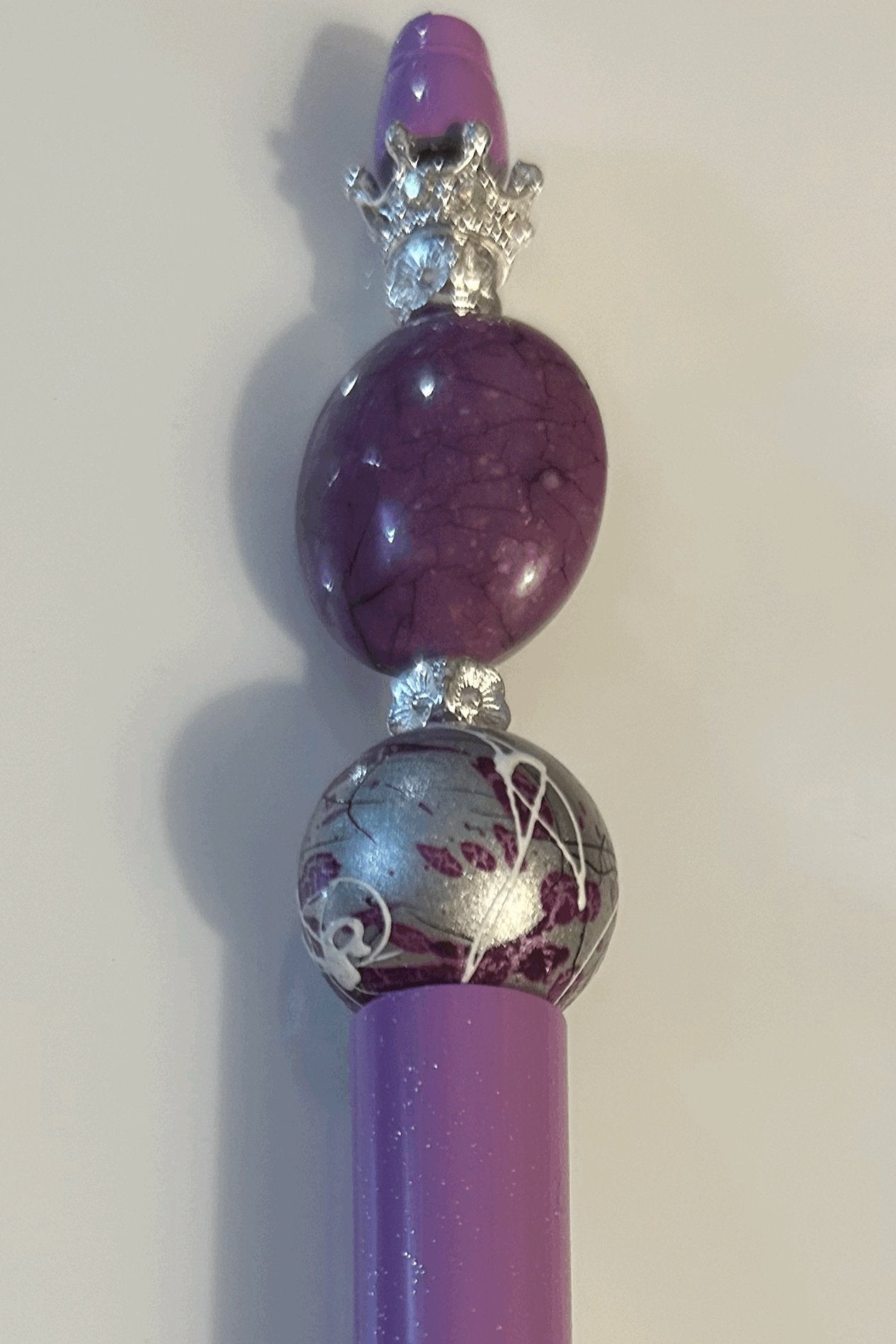 Purple and silver ball point pen