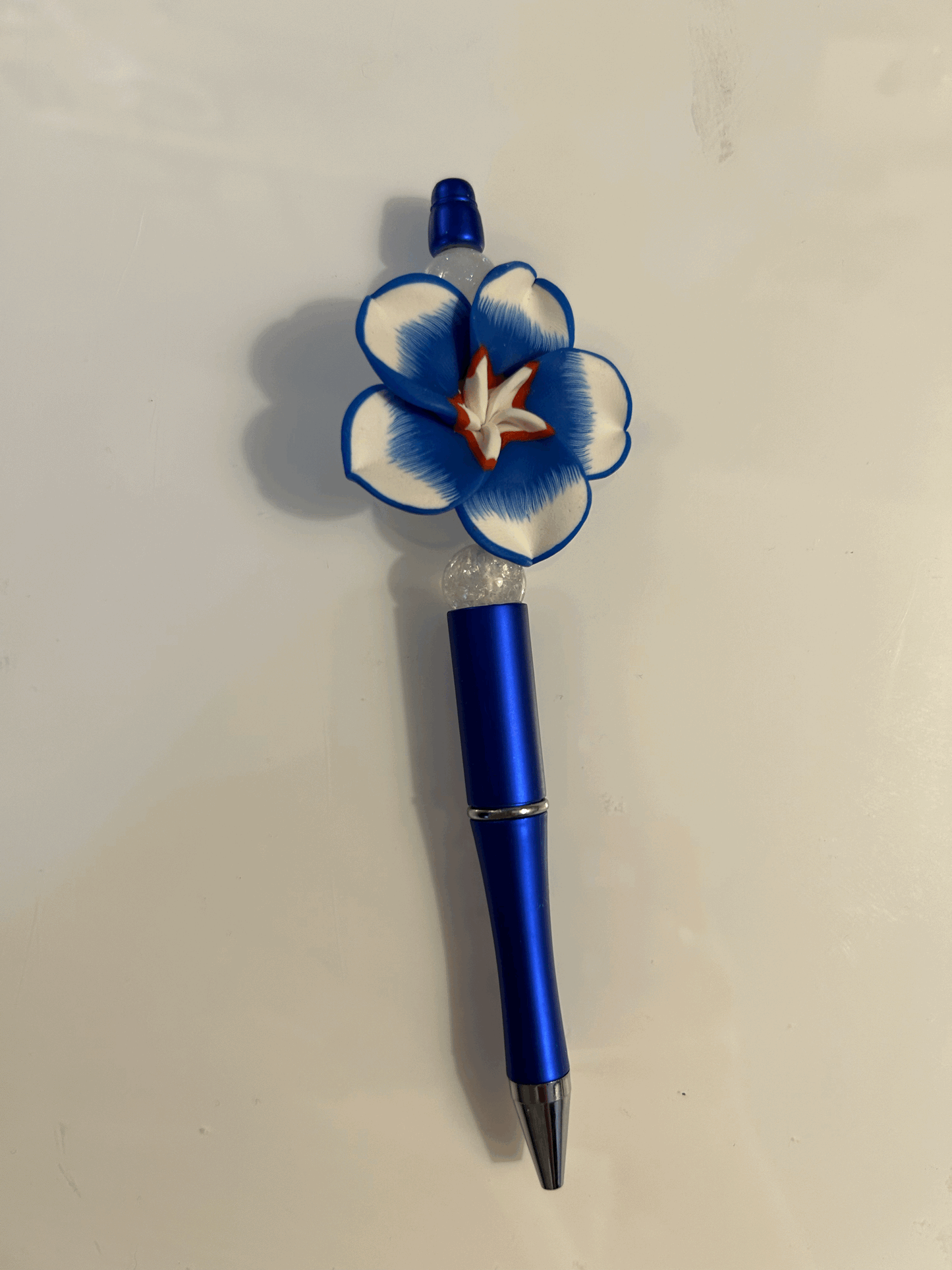 Red white and blue flower pen