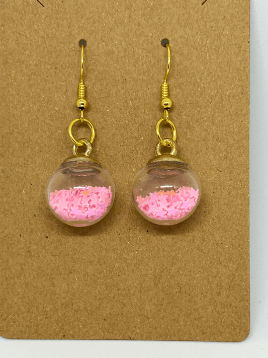 Pink star glass globe earrings