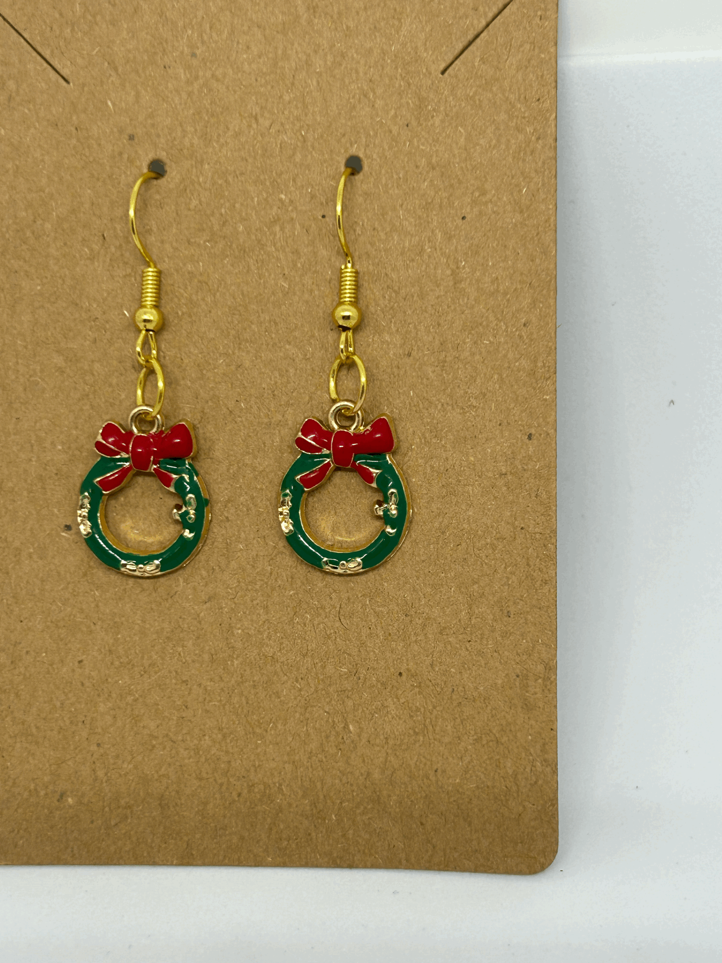 Green miniture  wreath  with a red bow  earring