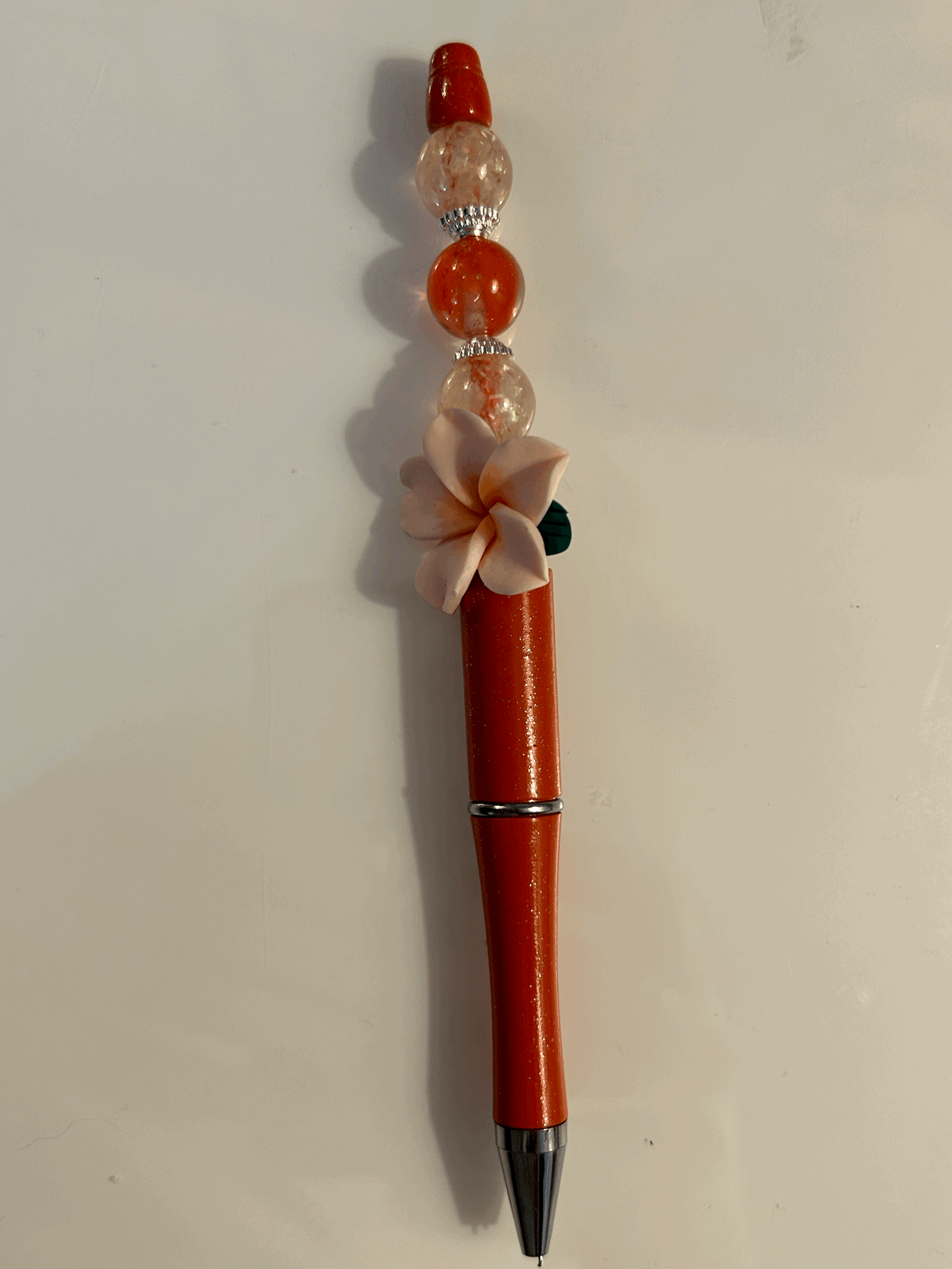 Pink flower with red and cream bead ball point pen