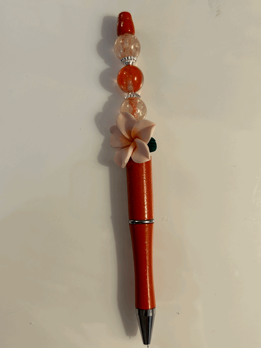Pink flower with red and cream bead ball point pen