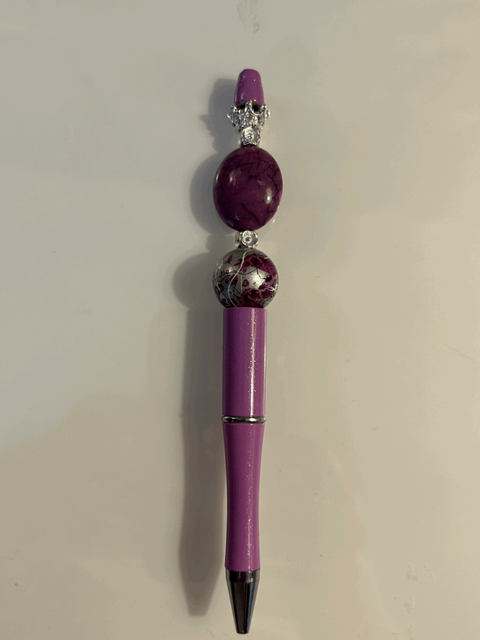 Purple and silver ball point pen